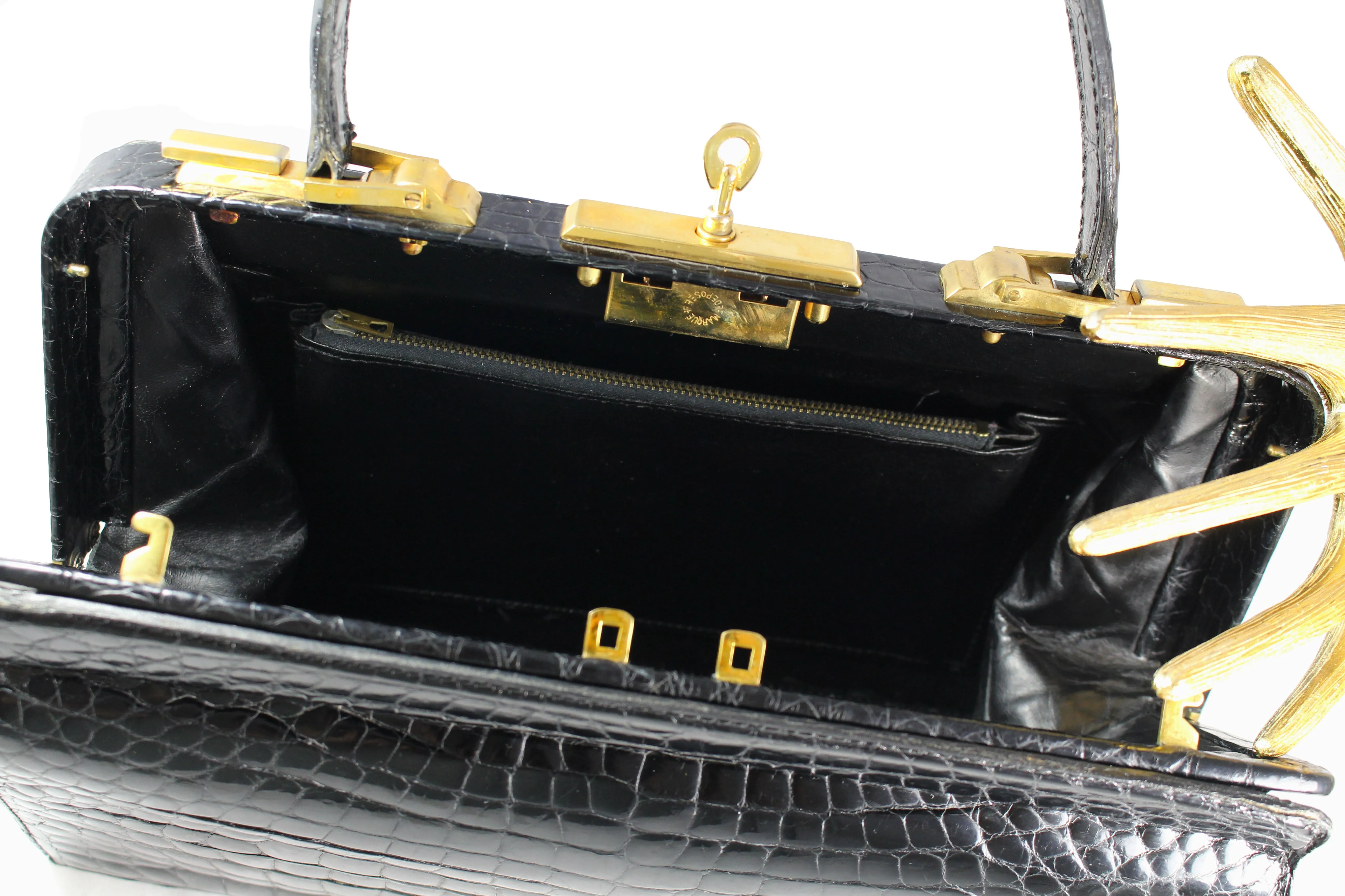 Black crocodile skin handbag with lined frame and key lock