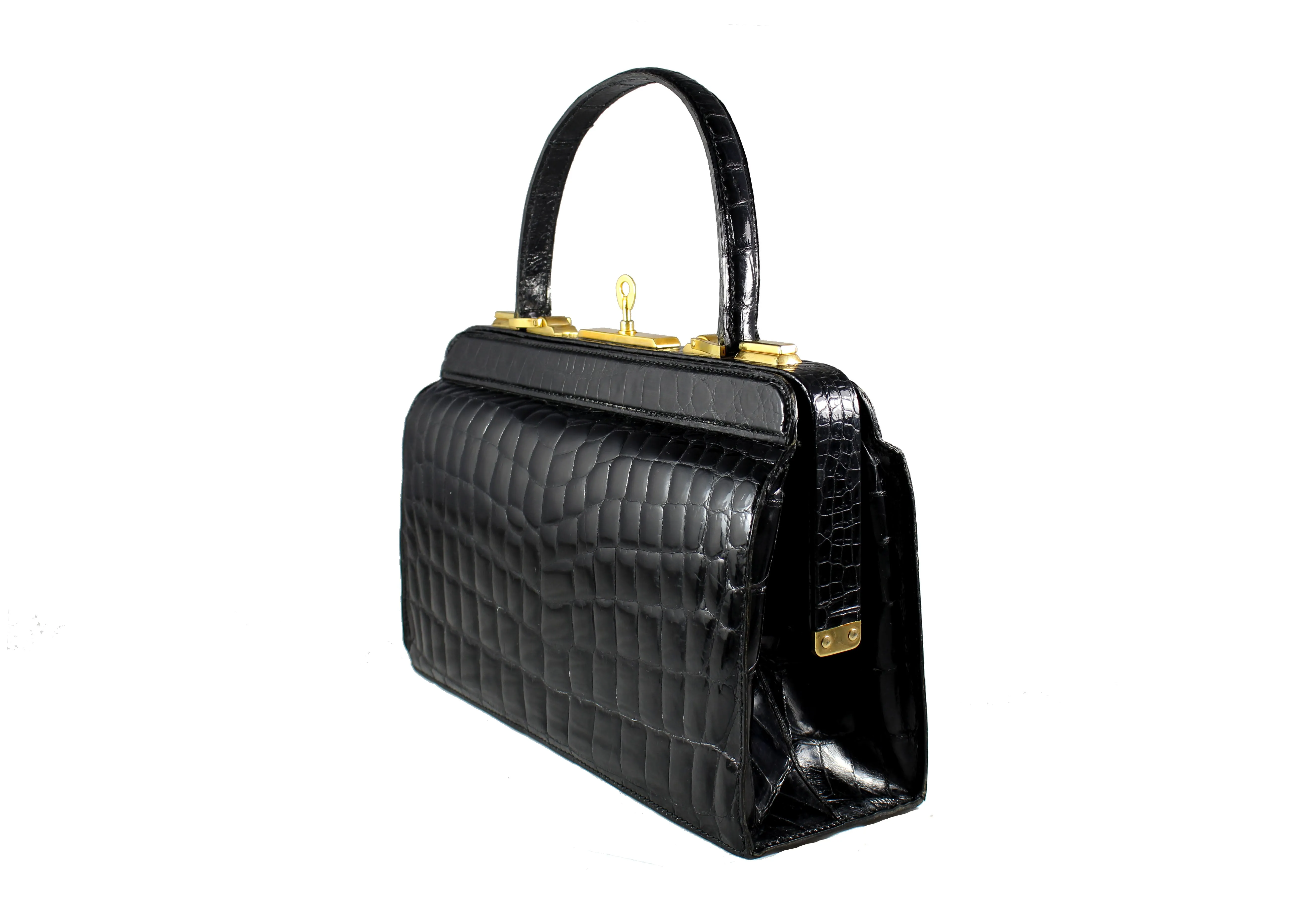 Black crocodile skin handbag with lined frame and key lock