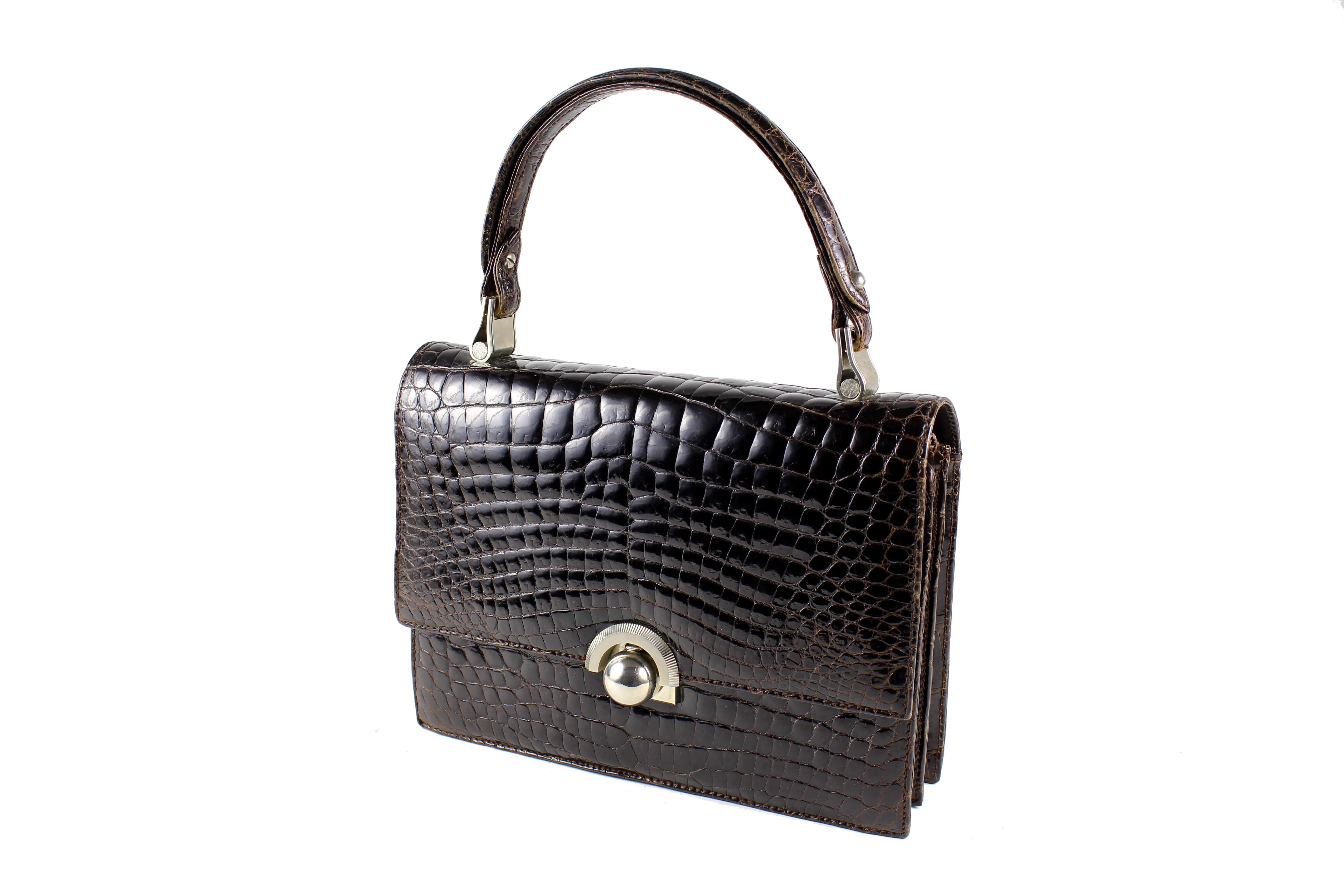 Brown crocodile skin handbag with flap and decorative clasp