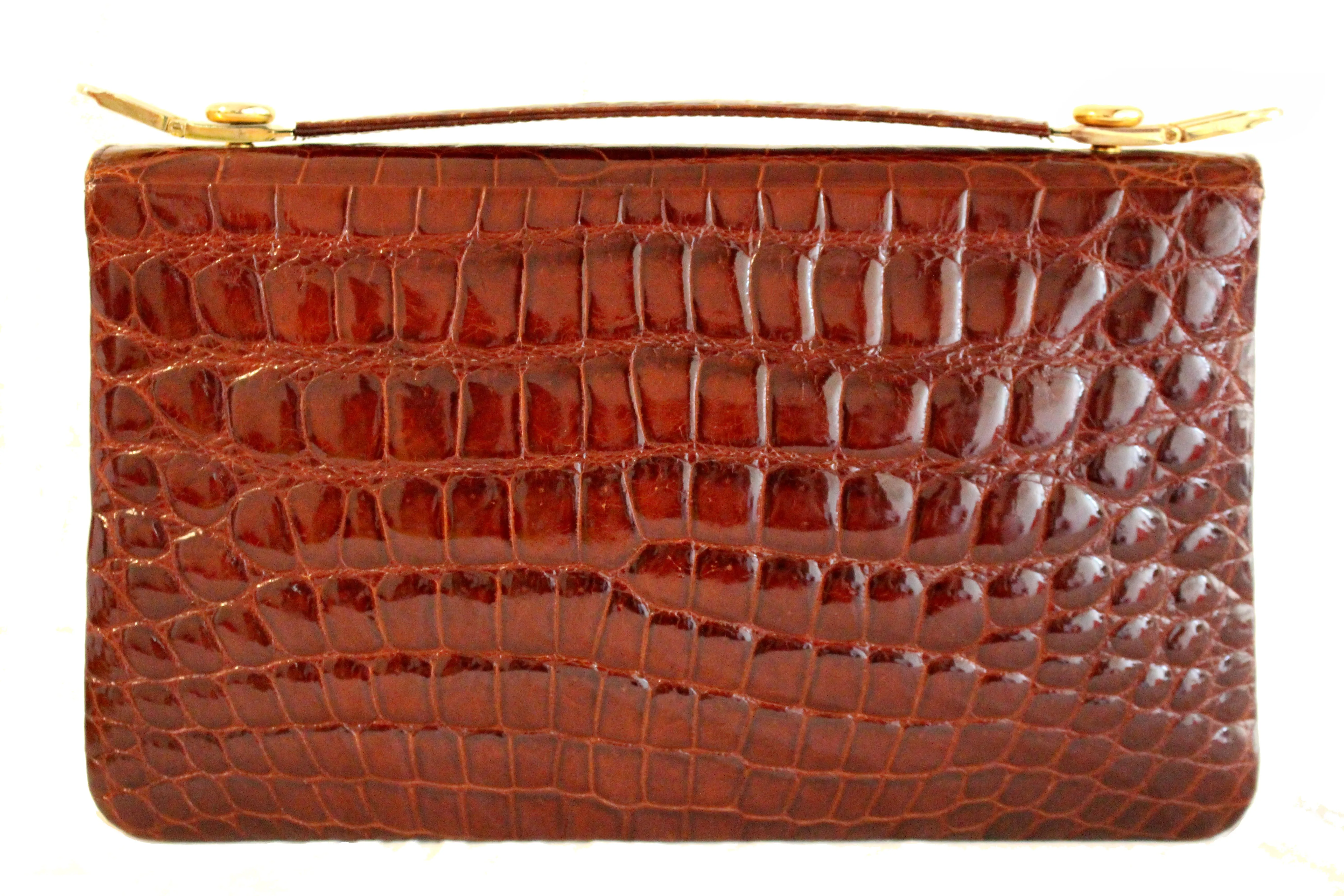 Rectangular cognac color crocodile skin handbag