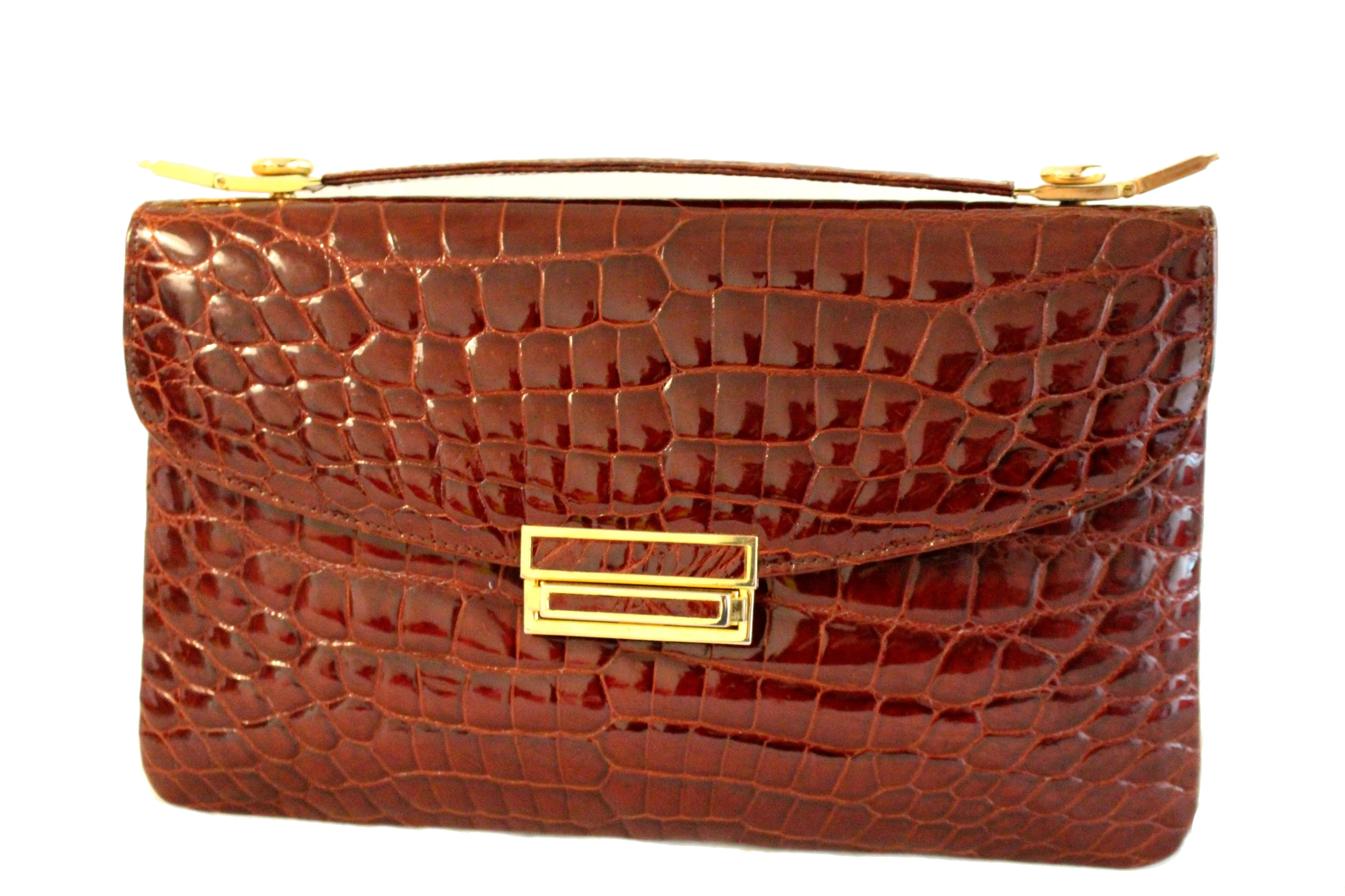 Rectangular cognac color crocodile skin handbag