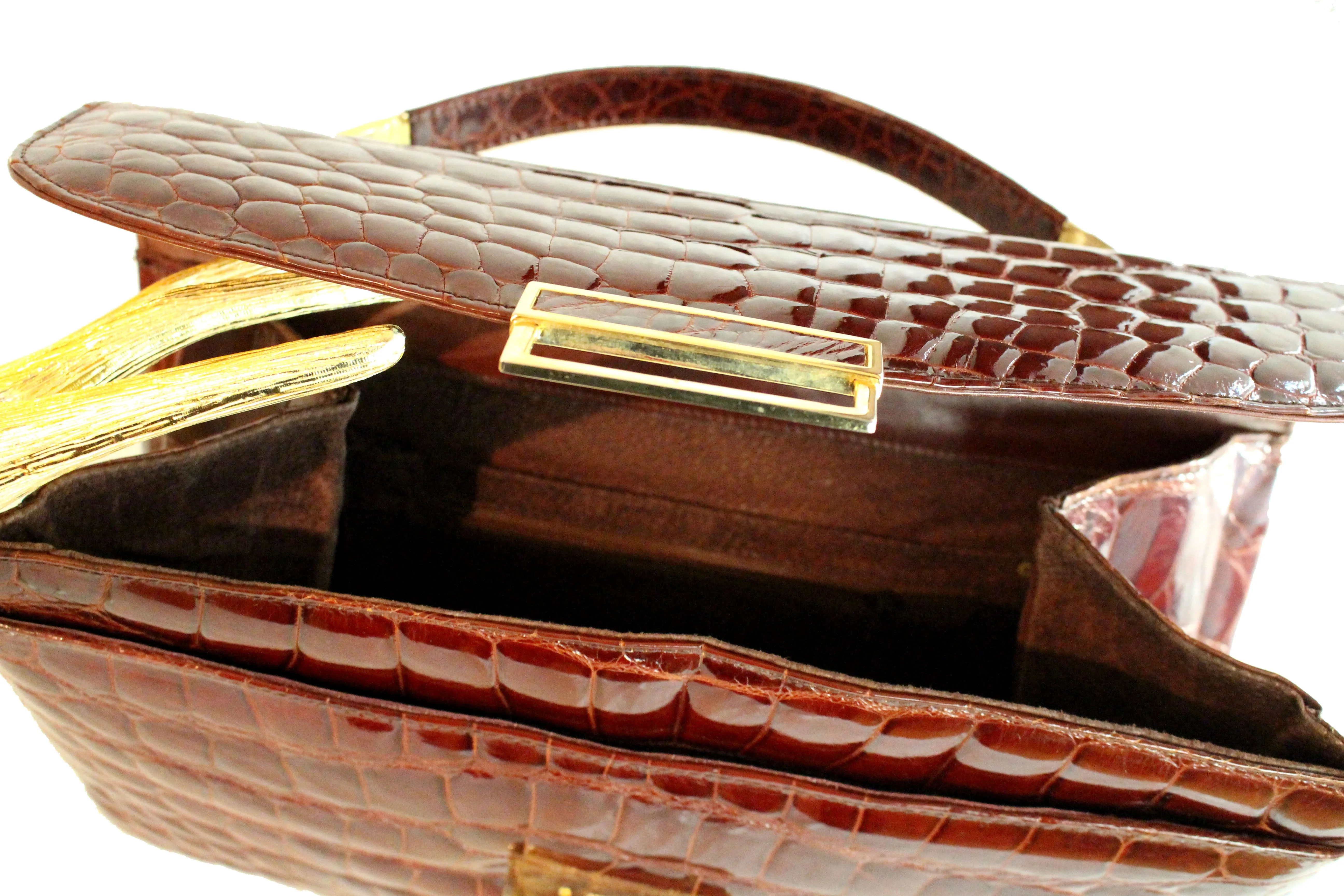 Rectangular cognac color crocodile skin handbag